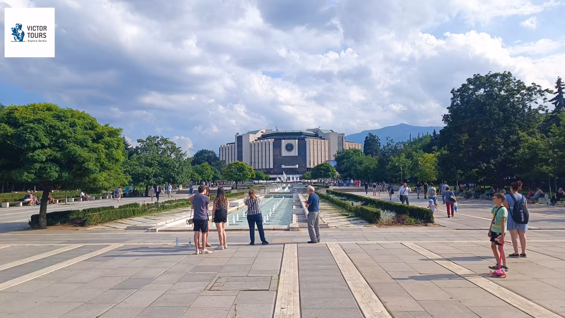 Visitors enjoying the vibrant atmosphere of the National Palace of Culture in Sofia, Bulgaria on the Balkan Express tour.