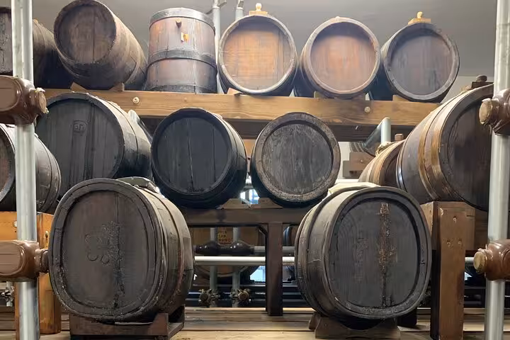 Aging barrels of balsamic vinegar showcased on the Parmesan and Balsamic Vinegar tour, highlighting traditional methods.