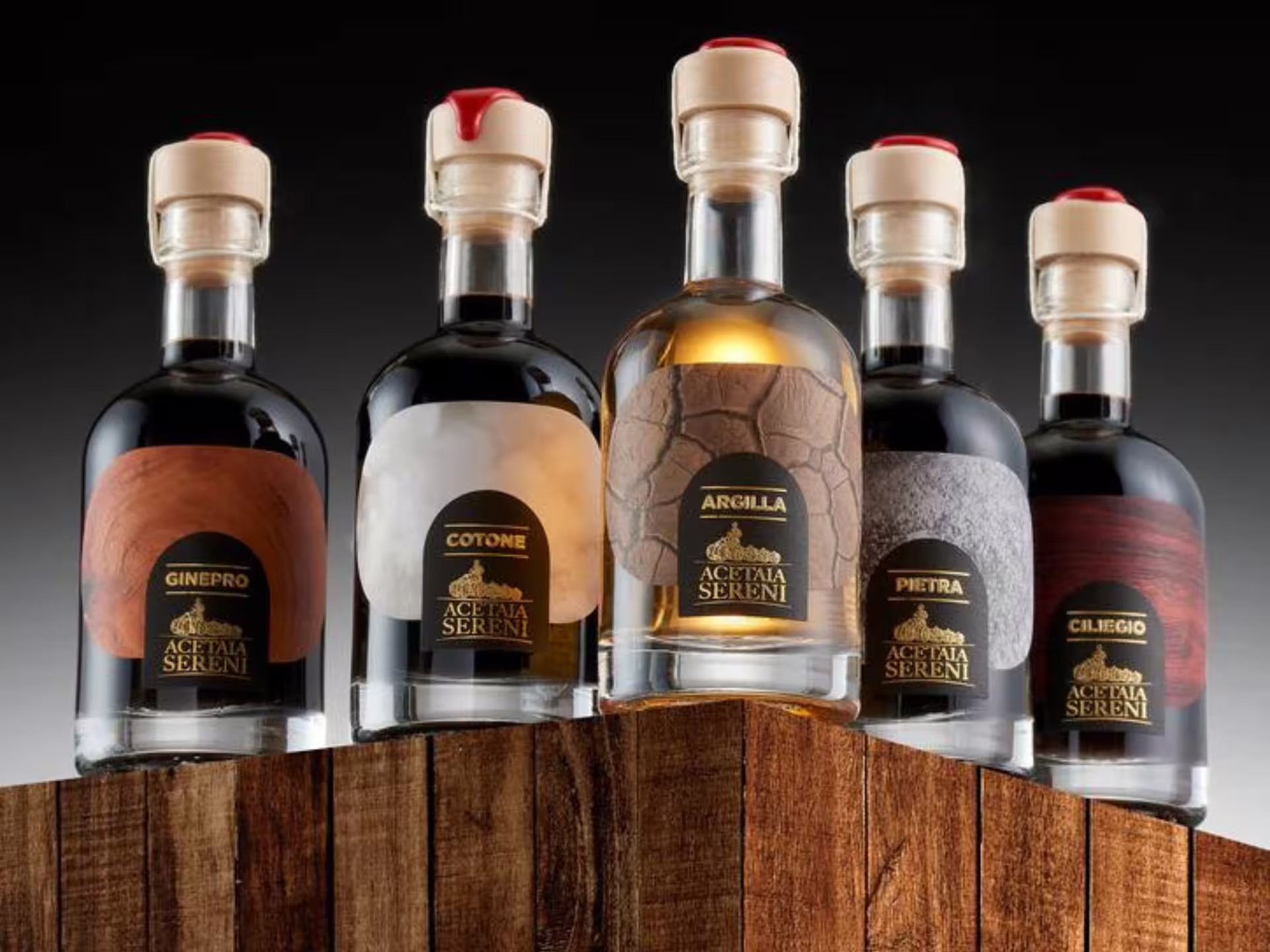 Artisan balsamic vinegar bottles from Modena, ideal for tasting during a guided acetaia production tour