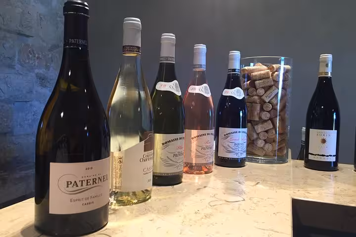 Bandol and Cassis wine tasting bottles and corks on table, Provence vineyard tour from Le Castellet