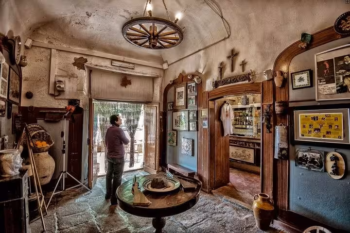 Interior of Bar Vitelli in Savoca, showcasing rustic decor and memorabilia from The Godfather film tour.