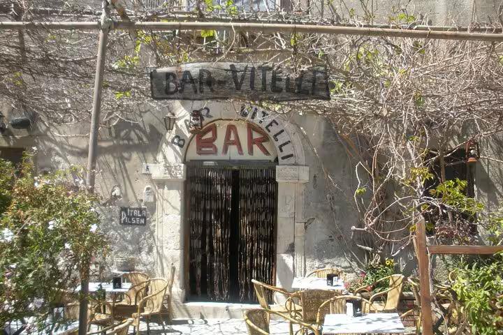 Bar Vitelli's charming rustic facade, a famous Godfather film location, invites visitors to relish authentic Sicilian atmosphere.