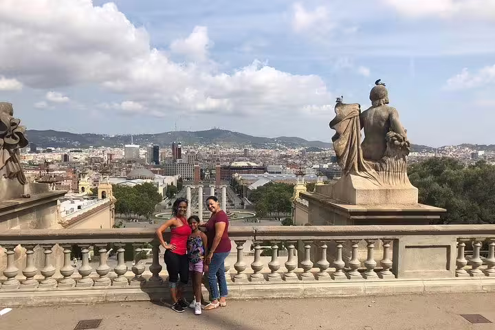 Family enjoying panoramic views of Barcelona from a historic vantage point on a semi-private city tour.