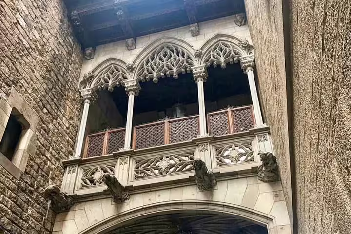 Gothic architectural details in Barcelona's historic quarter, showcasing intricate arches and stone carvings on a private tour.