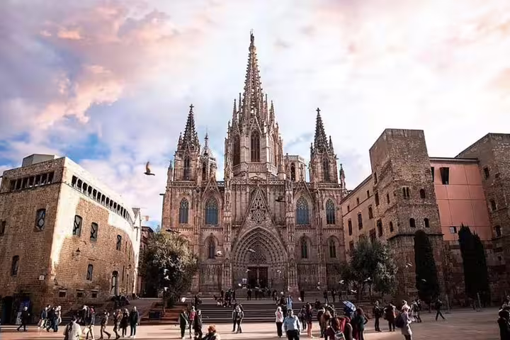 Barcelona Cathedral in the Gothic Quarter with vibrant sky and bustling visitors, ideal for city tour exploration.