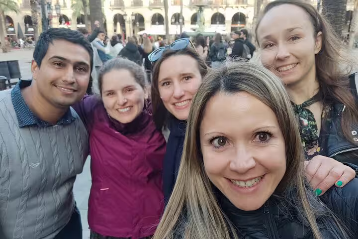 Group selfie with Plaça Reial crowds on Barcelona Gothic Quarter scavenger hunt and city highlights walking tour