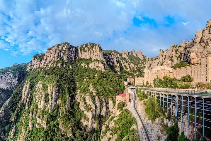 Scenic view of Montserrat mountains and monastery on a guided tour from Barcelona with convenient port or hotel pick-up.