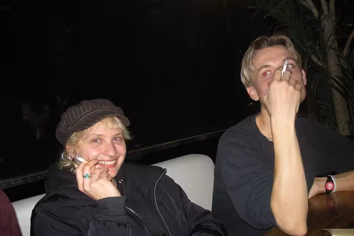 A lively group enjoying a night out in Barcelona, capturing the essence of nightlife with drinks and laughter.