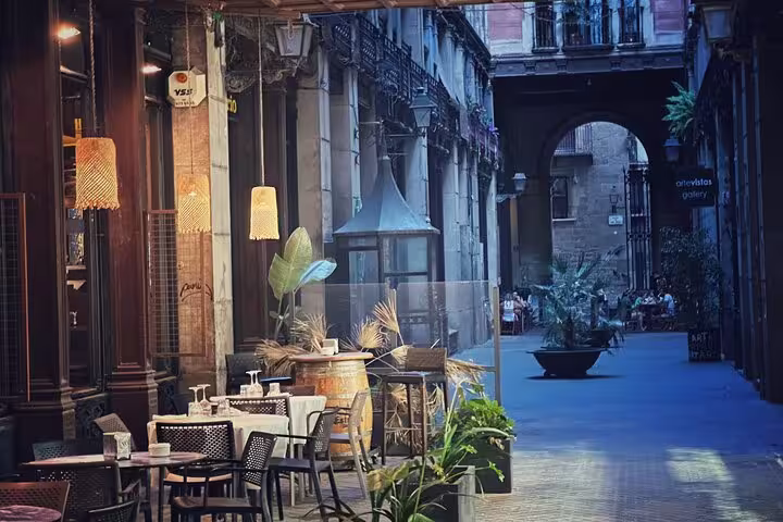 Cozy outdoor café in a quaint alleyway of Old Town, offering a relaxing stop amidst historic surroundings.
