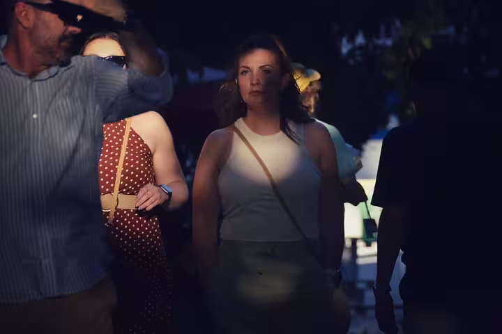 Two women laughing and enjoying a stroll through the charming streets during the 1.5h Private Old Town Tour.