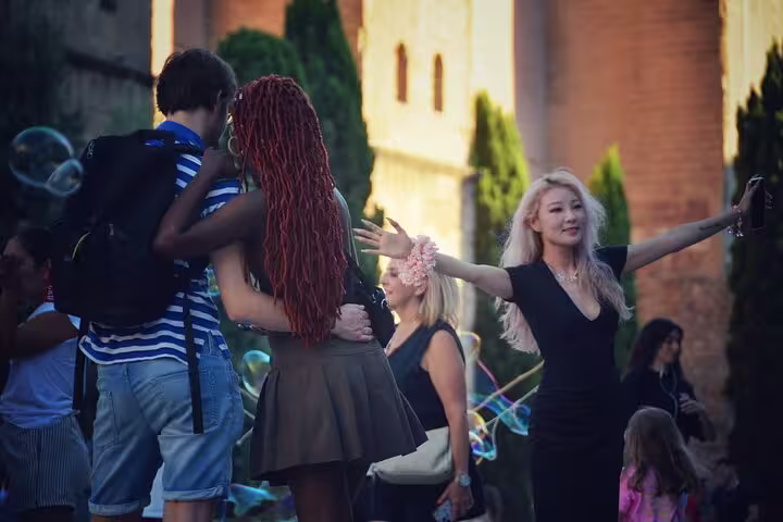 A lively scene of tourists enjoying their time in a vibrant setting, capturing moments during the Old Town Tour.