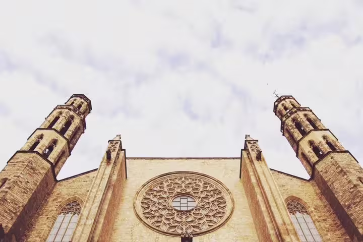 View of the iconic Gothic architecture of Santa Maria del Mar Basilica in Barcelona, featured in a walking tour itinerary.