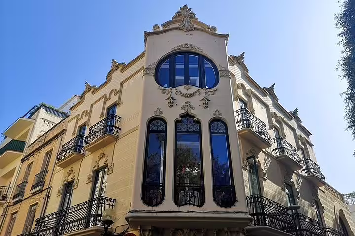 Elegant Art Nouveau building with intricate details in Sitges, part of the Barcelona City and Sitges tour.