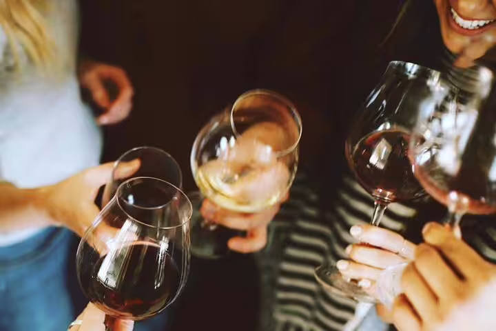 Group enjoying wine during the Small Group Barcelona Walking Tour, Flamenco Show & Tapas Dinner experience.