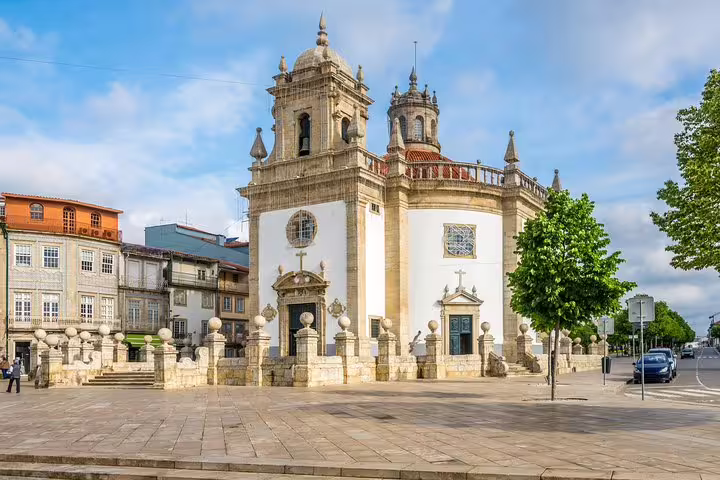 Barcelos' historic church framed by a clear blue sky, showcasing the architectural beauty of this half-day Porto tour.