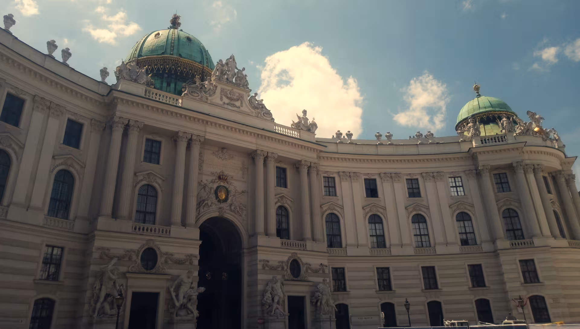 Baroque Hofburg palace facade with green domes, a highlight on the Secret Vienna 3-hour walking tour