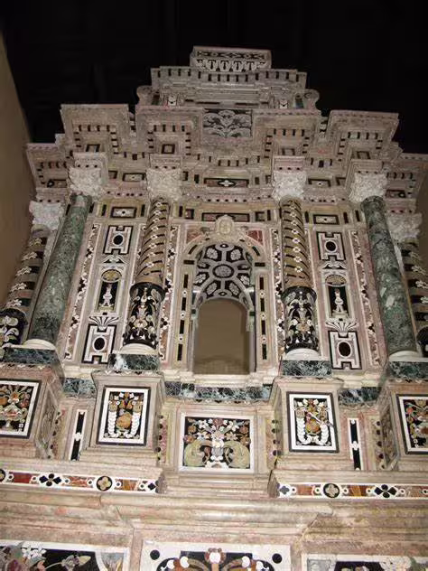 Intricate Baroque marble altar with inlaid columns and religious motifs in a historic church on the Costa dei Saraceni tour