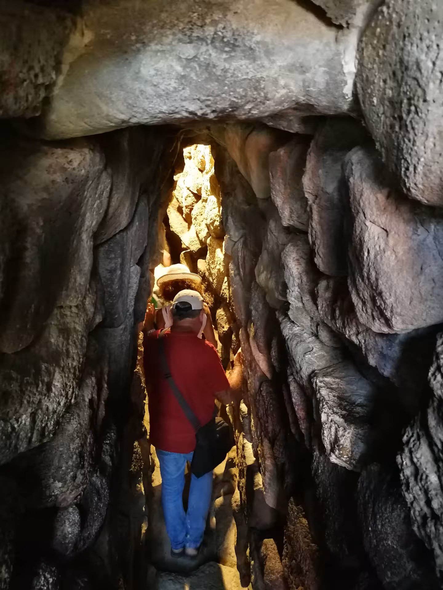 Tourists navigate the narrow passageways of Barumini's fascinating archaeological site on a guided tour from Cagliari.