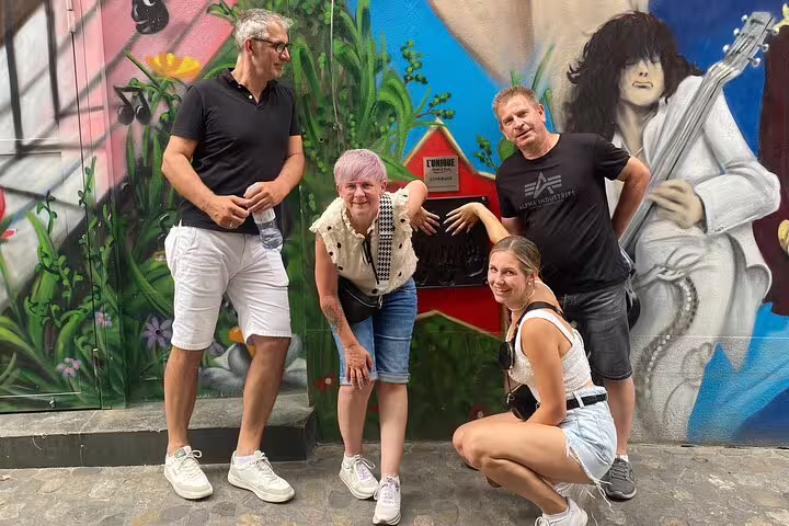 Team at a graffiti wall landmark on the Basel scavenger hunt, enjoying a self-guided sightseeing tour