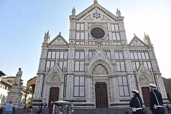 Facade of Basilica di Santa Croce in Florence with tourists in front, featured on La Spezia and Carrara day tour itinerary