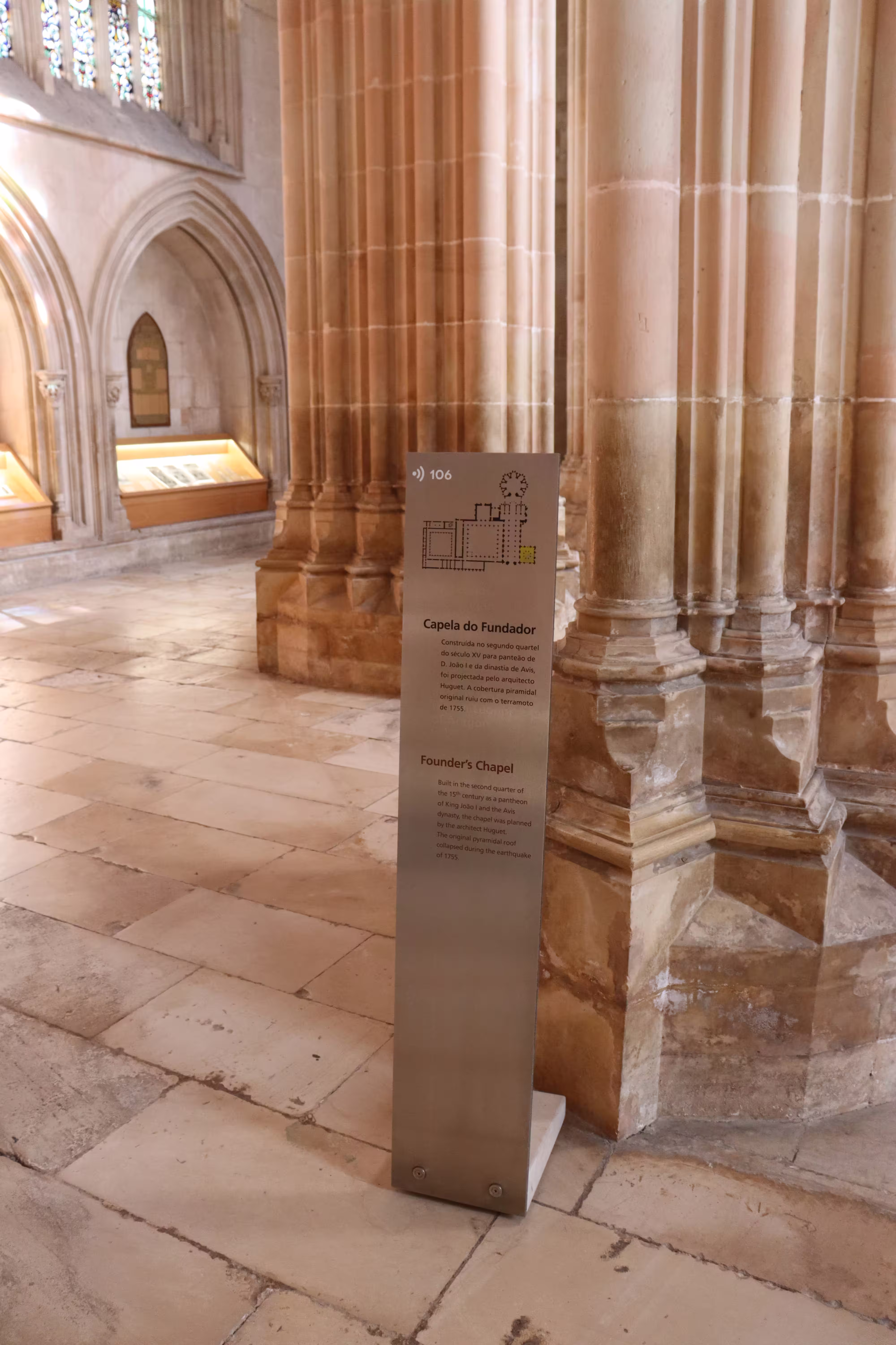 Interior view of Batalha Monastery's Founder's Chapel with historical information plaque, highlighting Portugal's rich heritage.