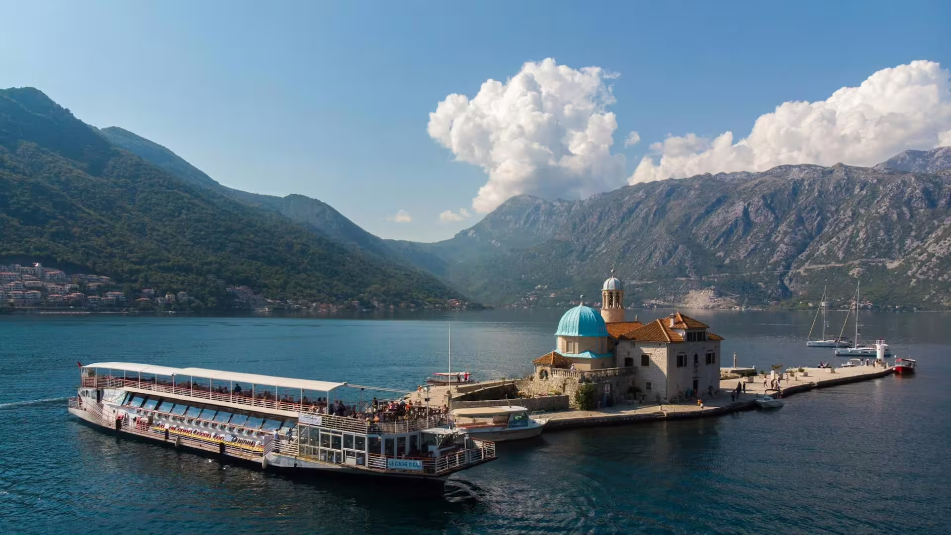 Cruise boat by Our Lady of the Rocks island in Bay of Kotor, Montenegro, day tour from Dubrovnik