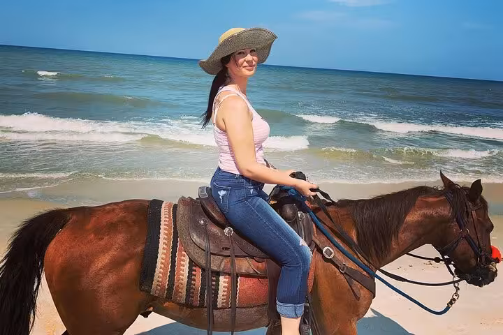 Beach horseback ride in Hurghada with Red Sea views, part of the 3-hour swim with horses experience