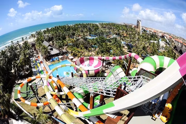 Aerial view of Beach Park water park slides by the ocean in Fortaleza, ideal for shared transfer service