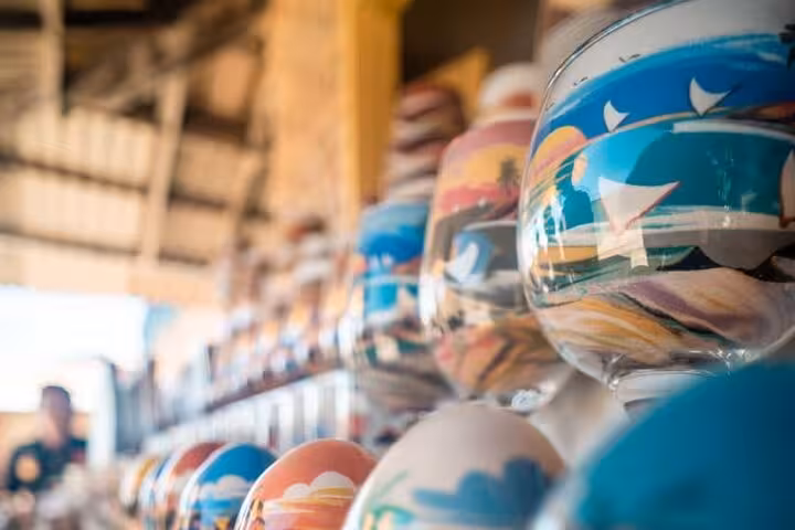 Colorful beach souvenir bowls at a coastal stop on a three beaches in one day tour with local crafts