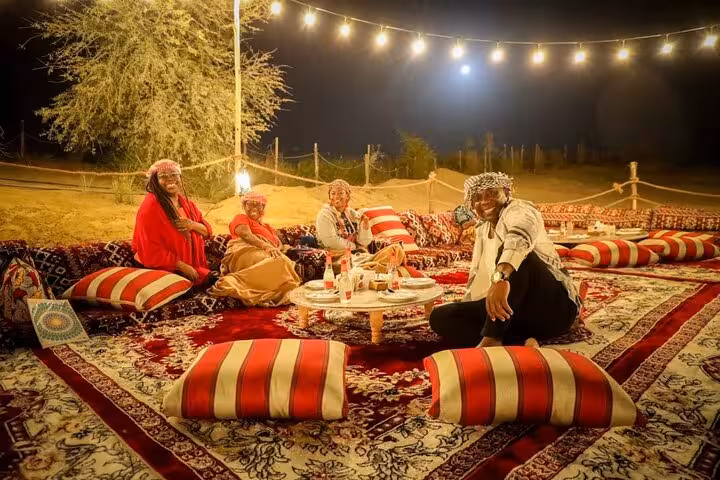 Bedouin dinner seating under string lights in Hurghada desert camp after jeep safari and stargazing tour