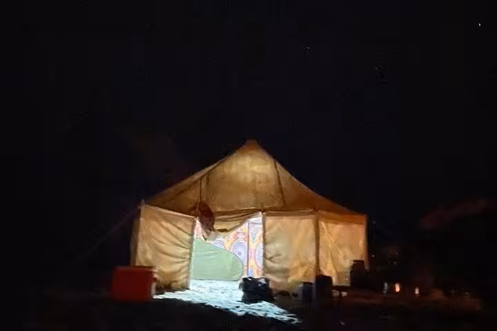 Bedouin-style tent under starry sky in Egypt’s White Desert, part of private 2-day camping experience