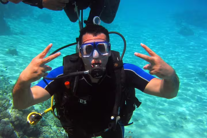 Beginner scuba diver underwater in clear turquoise sea, ideal intro diving and snorkeling day trip experience