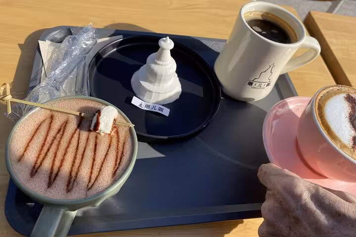 Cappuccino and specialty drinks inspired by the White Pagoda on a Beijing sidecar food tour.