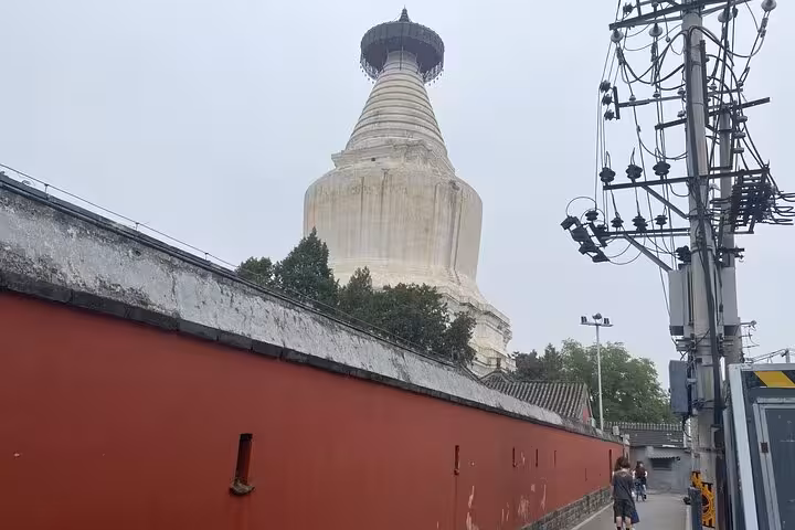Scenic view of a historic Beijing pagoda along the route of the Sidecar Food Tour, highlighting local architecture.