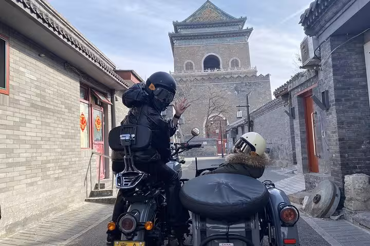 Sidecar riders admire Beijing's iconic architecture during the 2-hour Ancient & Modern Sidecar Tour.