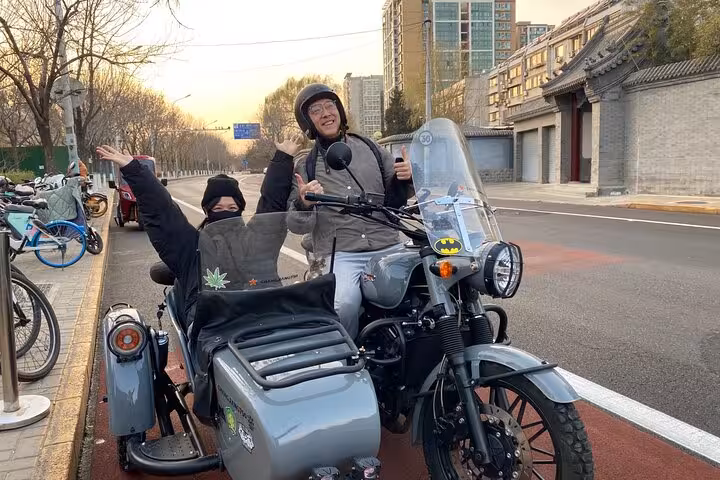 Enthusiastic riders prepare for a unique Beijing sidecar tour, capturing the essence of exploration and discovery.