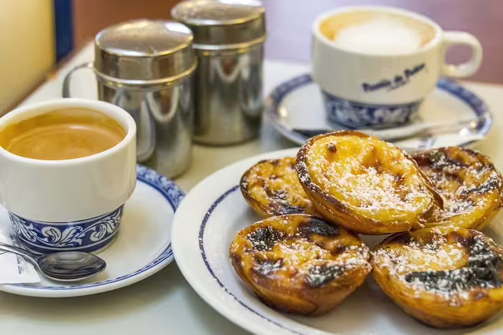 Savor authentic pastéis de nata and rich espresso during a Belem private day trip exploring history, heritage, and local flavors.