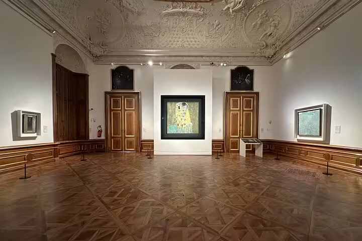 Elegant gallery room in the Belvedere showcasing Gustav Klimt's 'The Kiss,' a highlight of the themed art historian tour.