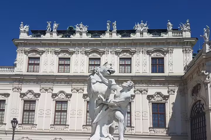 Stunning exterior of Belvedere Palace with classical statues, perfect for private art history tour with skip-the-line access.