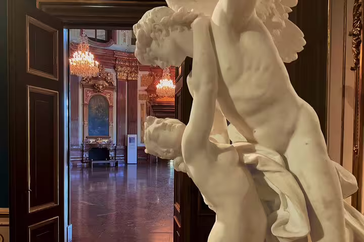 Intricate marble sculpture in grand hall of Belvedere Palace, showcasing Austrian art and history on private tour.