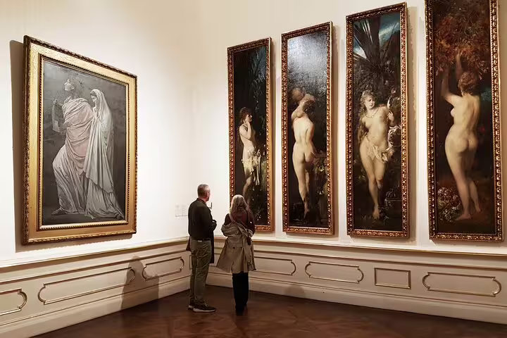Visitors admire artwork in a gallery at Belvedere Palace, showcasing Austrian art history on a private tour.