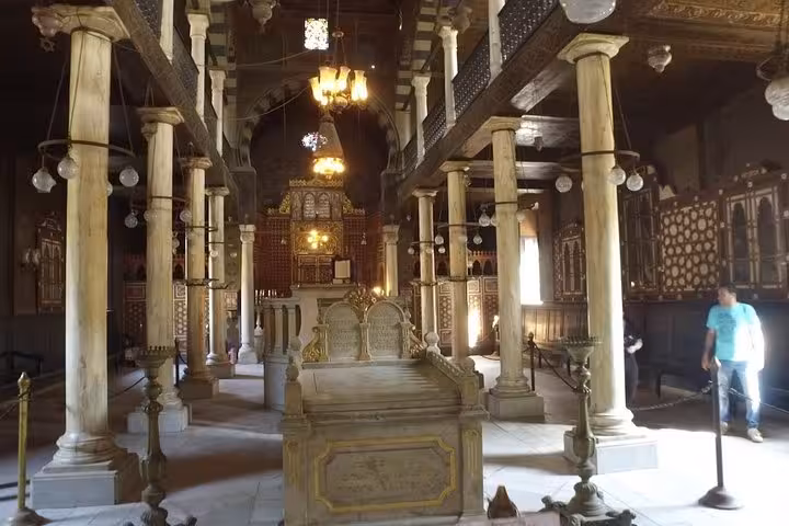Ben Ezra Synagogue interior in Coptic Cairo with marble columns and chandeliers on Muizz Street bazaar day tour