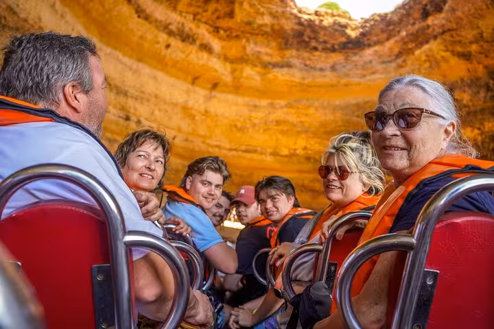 Guests in life jackets on Benagil Cave boat, part of all-inclusive private Lisbon to Algarve tour with cruise