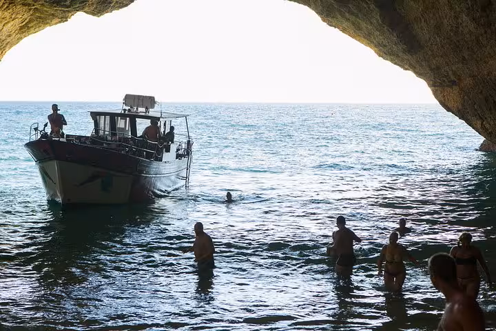 Guests relaxing aboard a catamaran tour to Benagil Cave