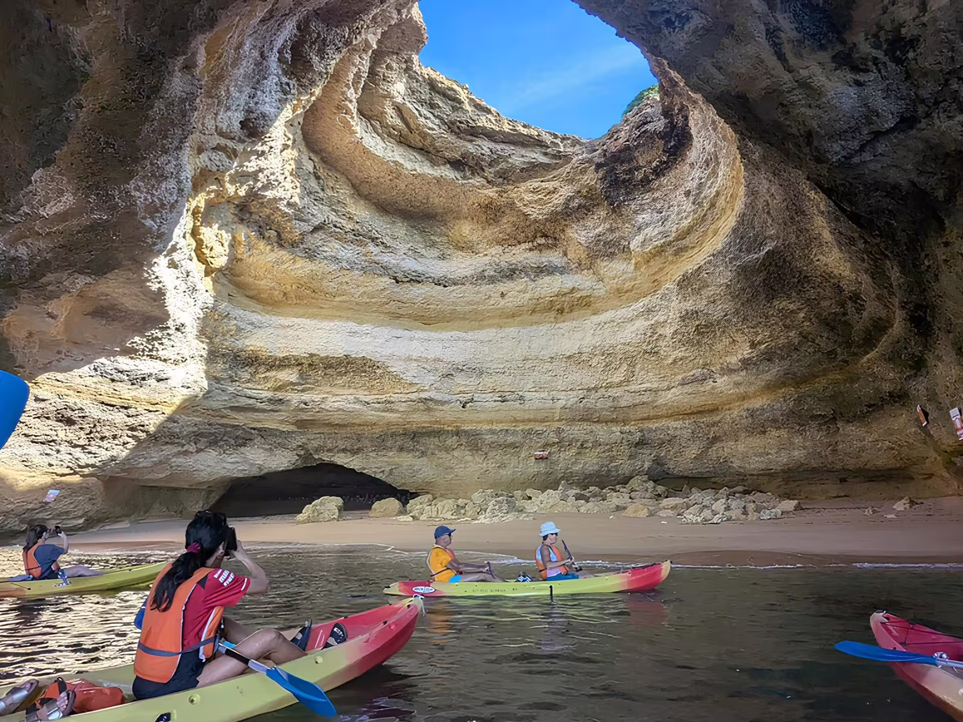 Kayakers explore the stunning Benagil Cave with a local guide, enjoying a small group tour and comfortable gear.