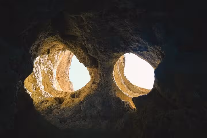 Benagil Cave interior view with twin skylights, highlight of private Lisbon to Algarve all-inclusive tour
