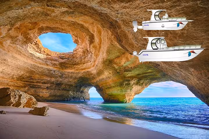 Tourists capturing Marinha Beach cliffs during a boat tour