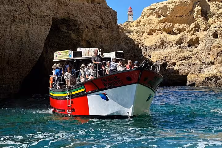 Tourists swimming in the crystal-clear water after visiting Benagil Cave