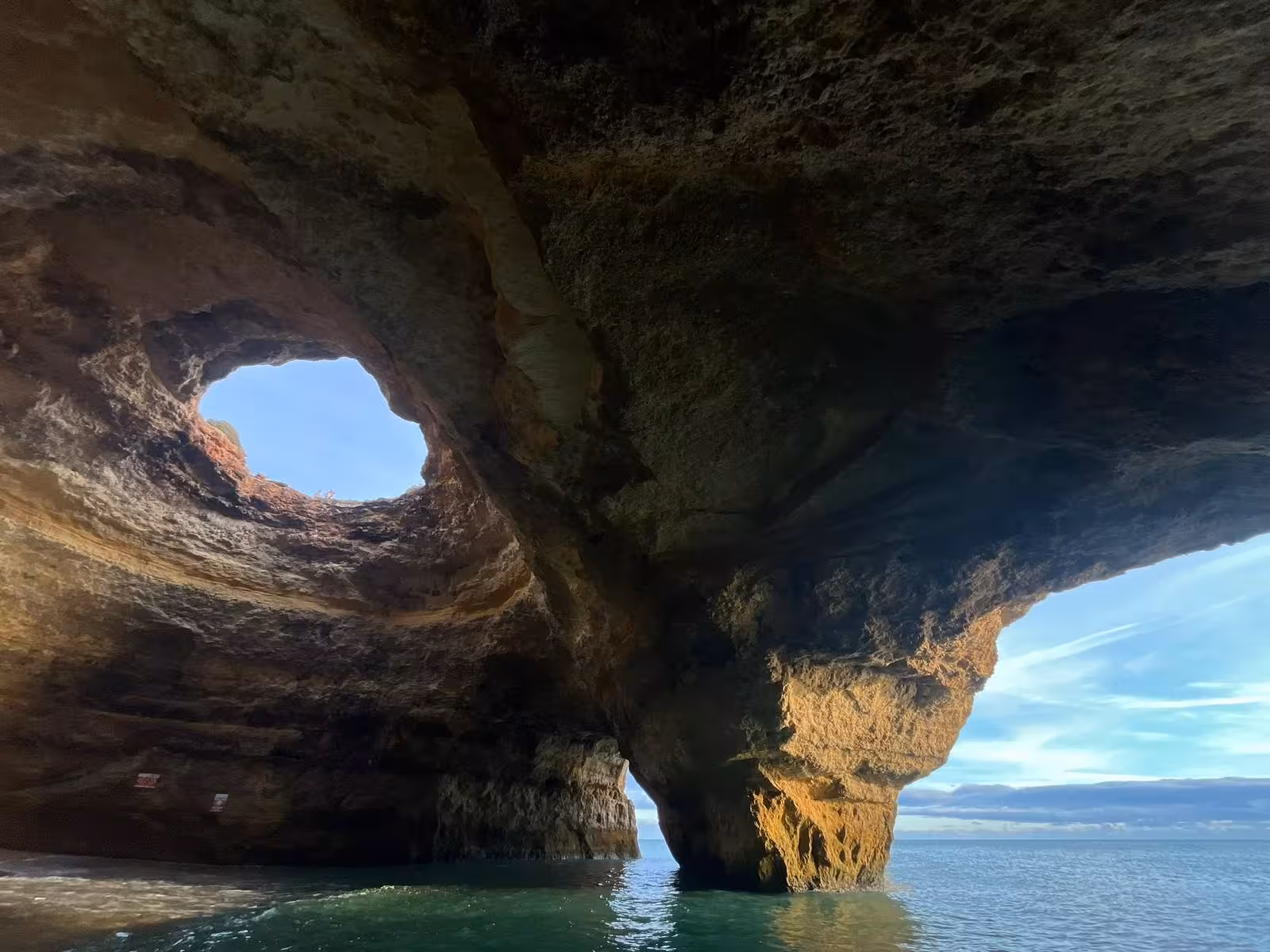 Sunlit Benagil Cave sea grotto with natural skylight and turquoise Atlantic water on a private 2-hour Algarve boat tour