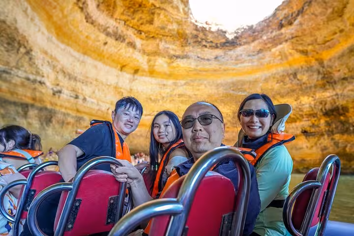 Guests on Benagil Caves boat trip exploring Algarve sea cave on private tour from Lisbon